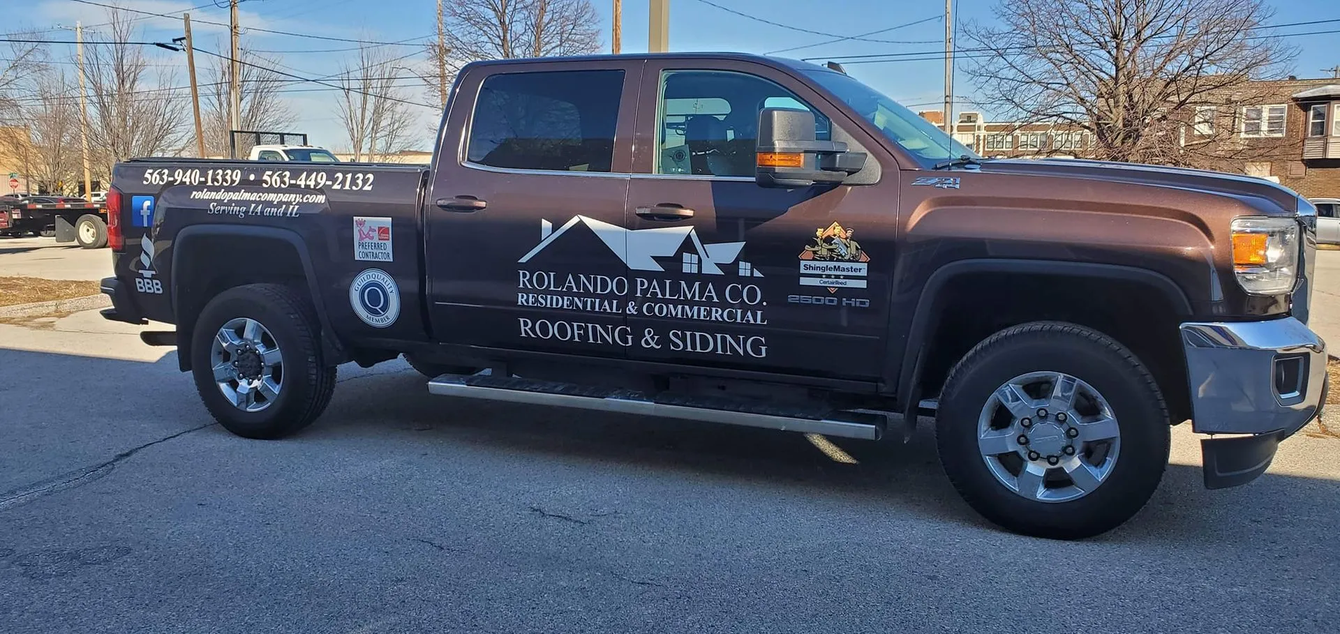 A brown truck is parked on the side of the road.