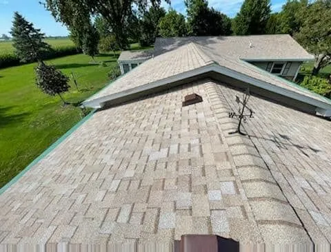 The roof of a house with a satellite dish on it